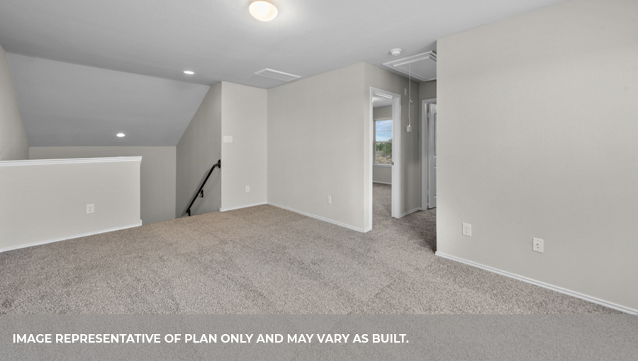Upstairs game room with carpet flooring.