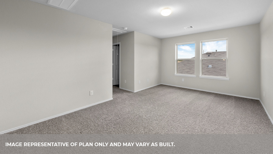 Upstairs game room with carpet flooring and bright windows.