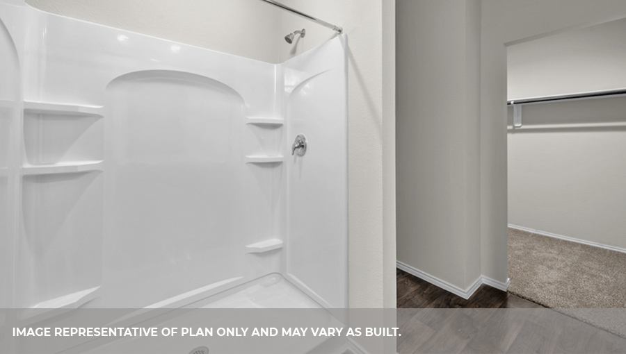 Primary bathroom with standing shower.