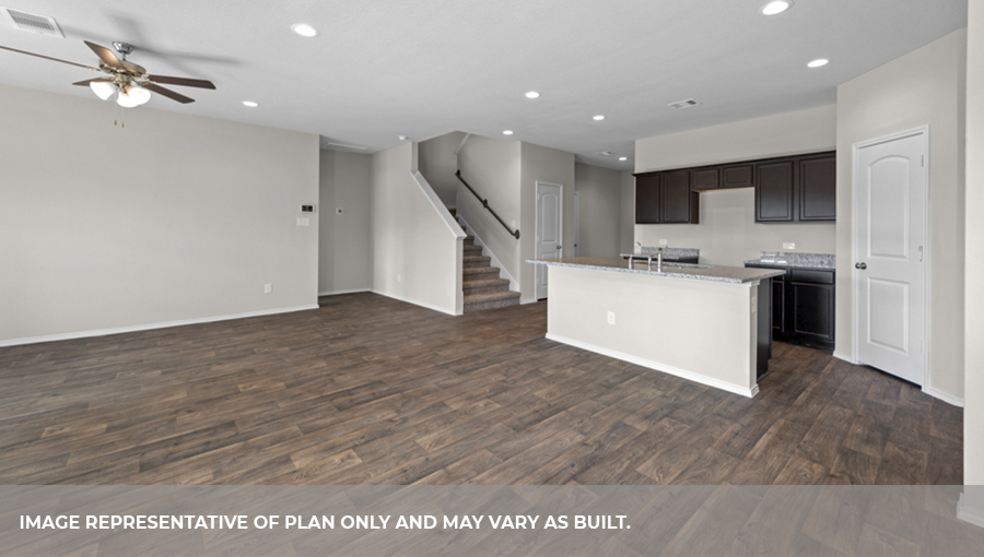 Open-concept living and dining space with vinyl flooring.