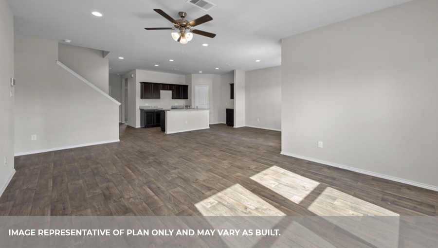 Open-concept living and dining space with vinyl flooring.
