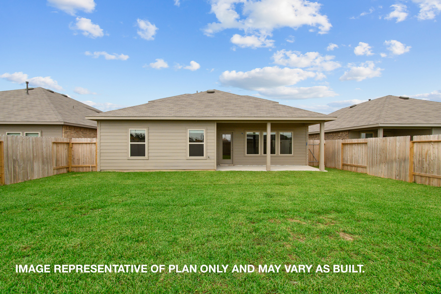 Landscaped backyard with patio.