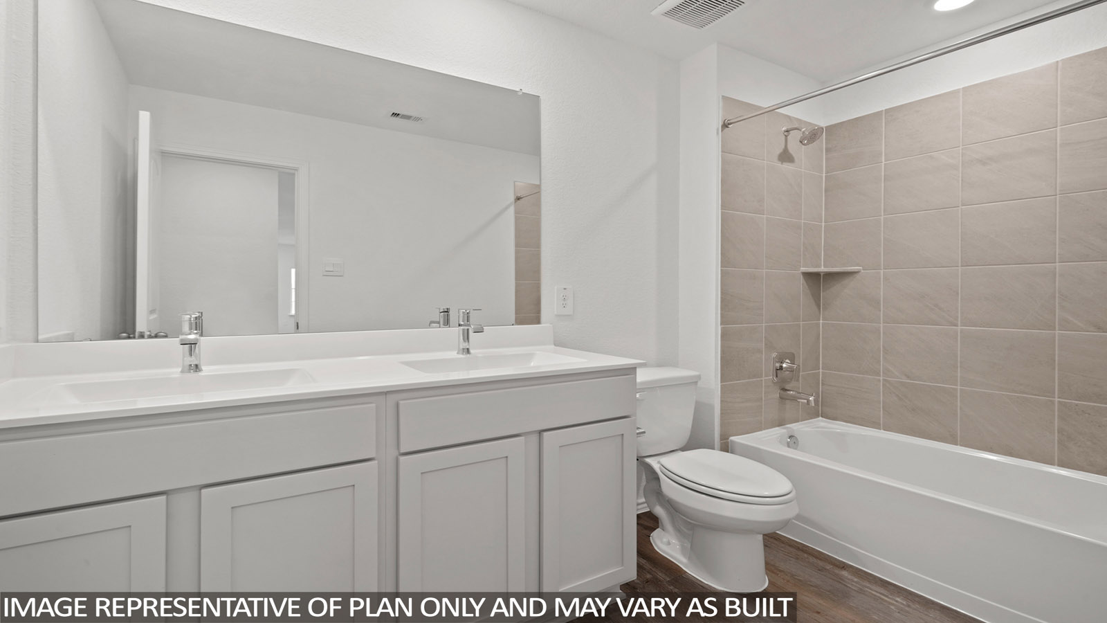 Secondary bathroom with dual sinks, a shower and tub combo, white walls, and vinyl wood flooring.