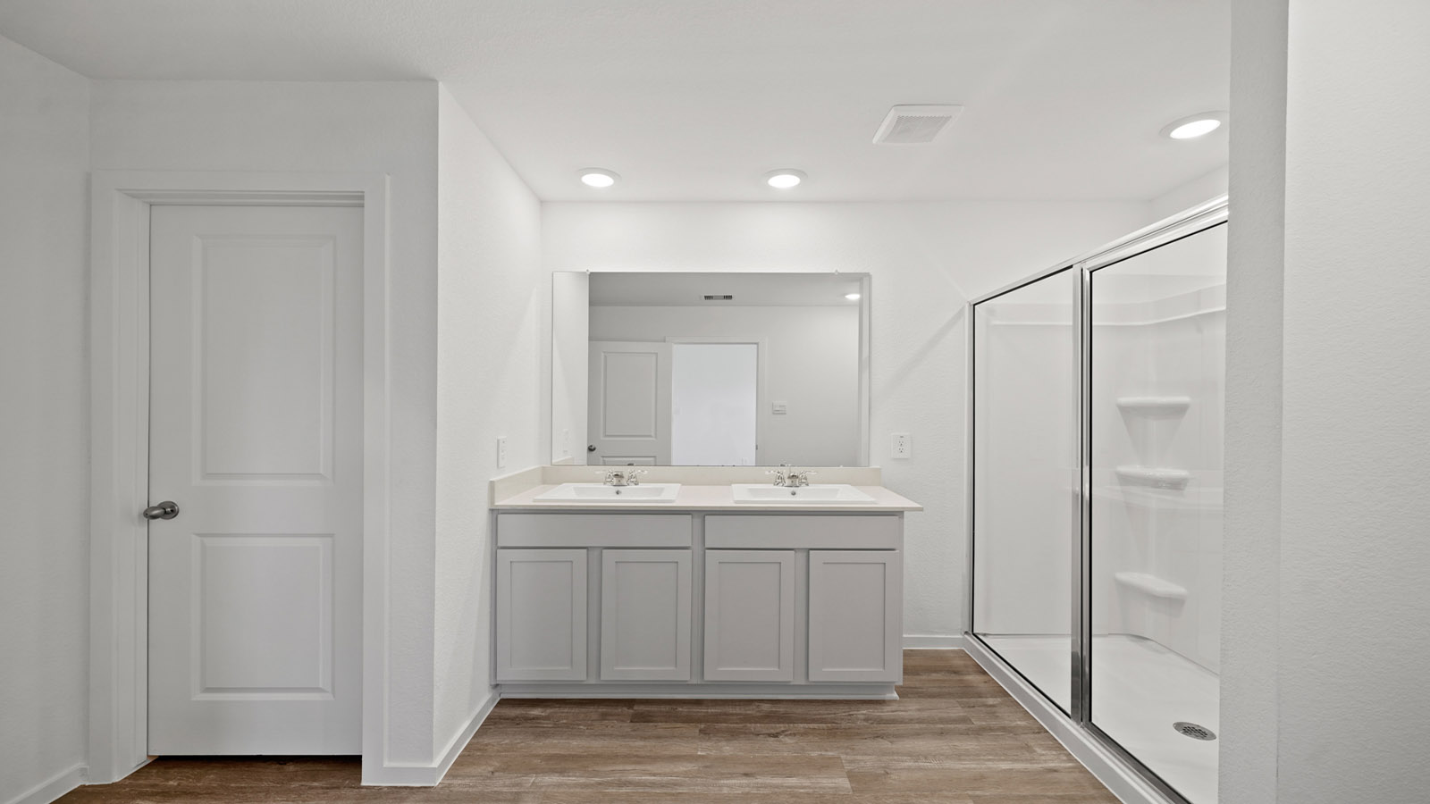 primary bathroom with stand up shower and built in shelving