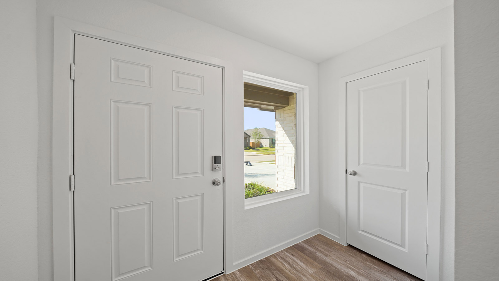 entryway with vinyl flooring and large window