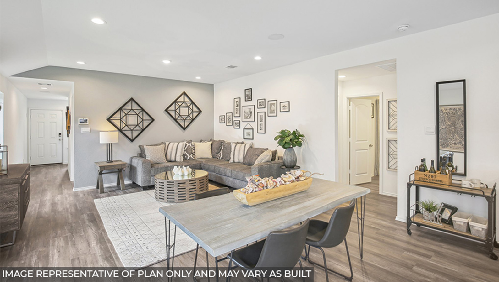 open concept living and dinnig area with vinyl flooring, quartz countertops, and large windows