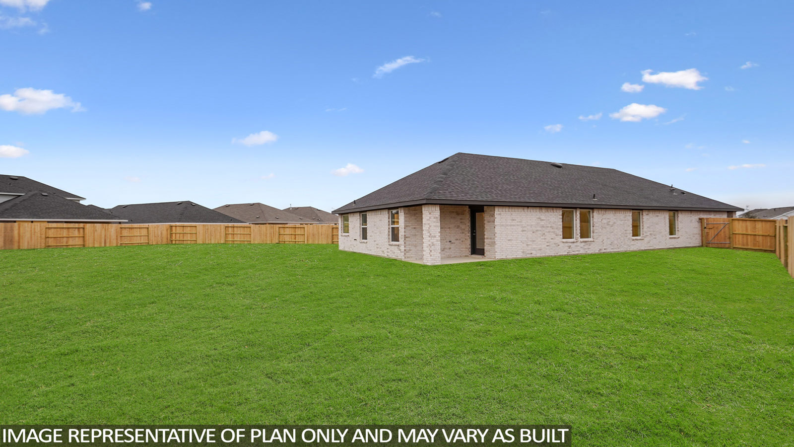 Landscaped backyard with a covered patio.