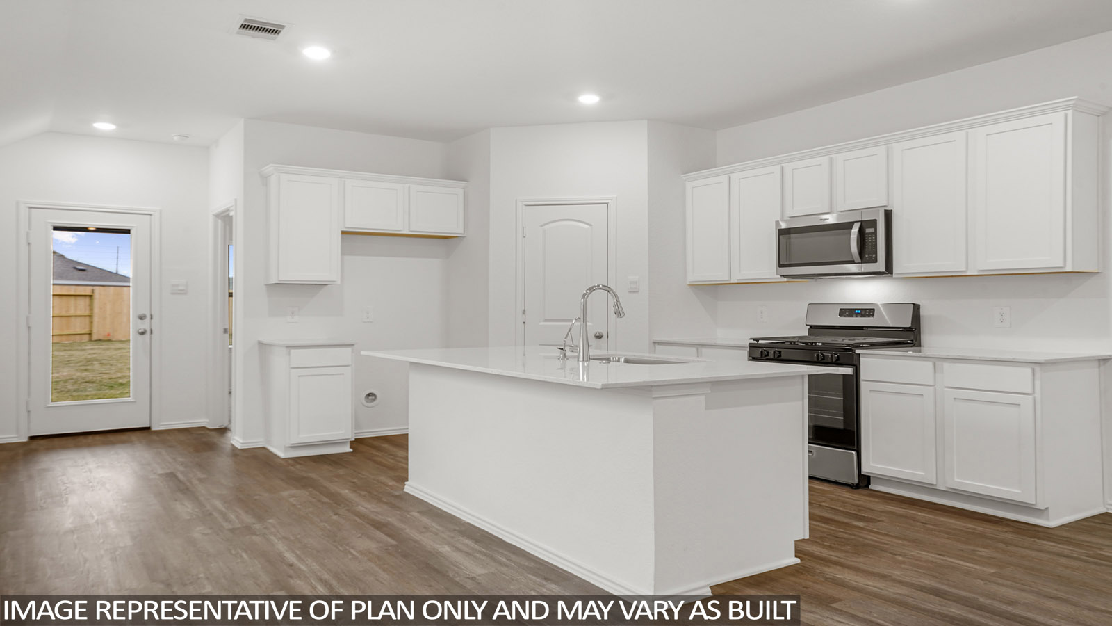 Open kitchen with an island, stainless steel appliances, white cabinets, white walls, and vinyl wood flooring.