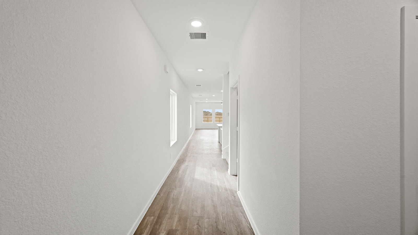 hallway with vinyl flooring
