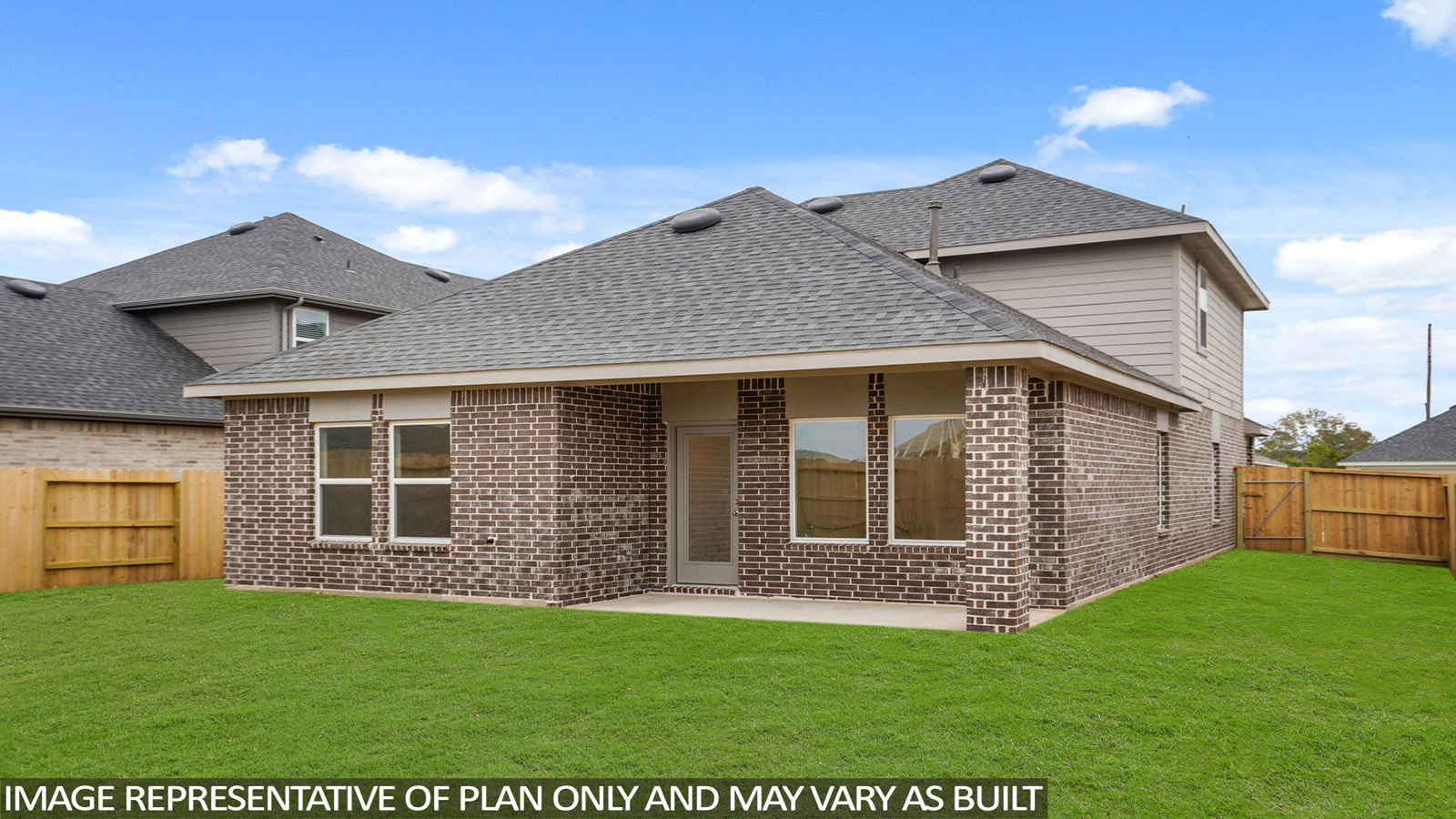 Landscaped backyard with a covered patio.