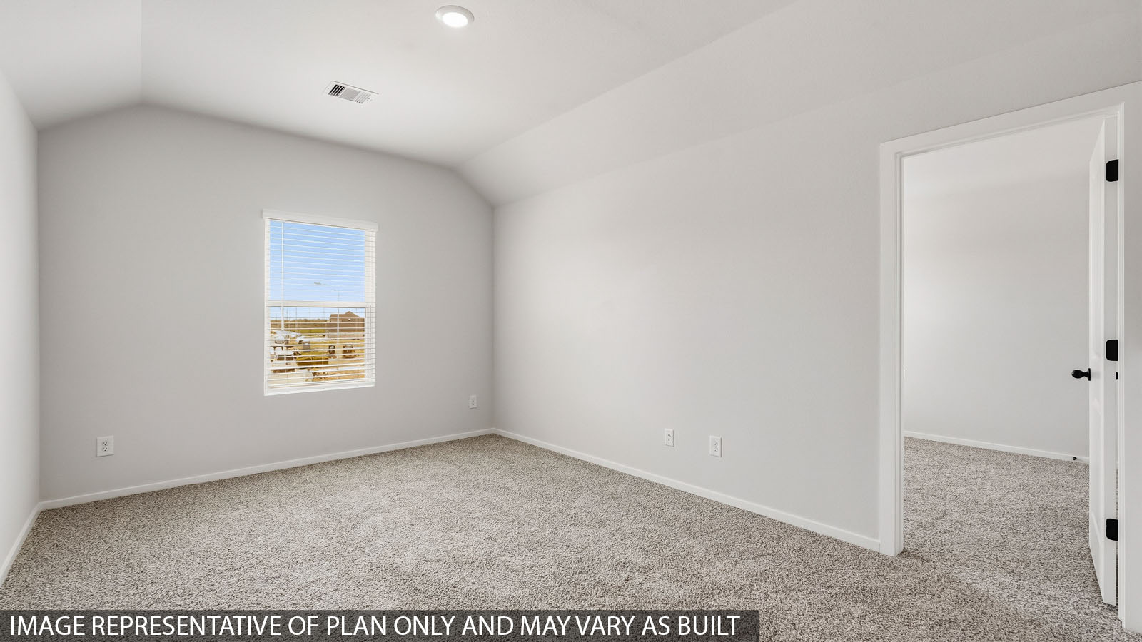 Secondary bedroom with windows, white walls, and light carpet.