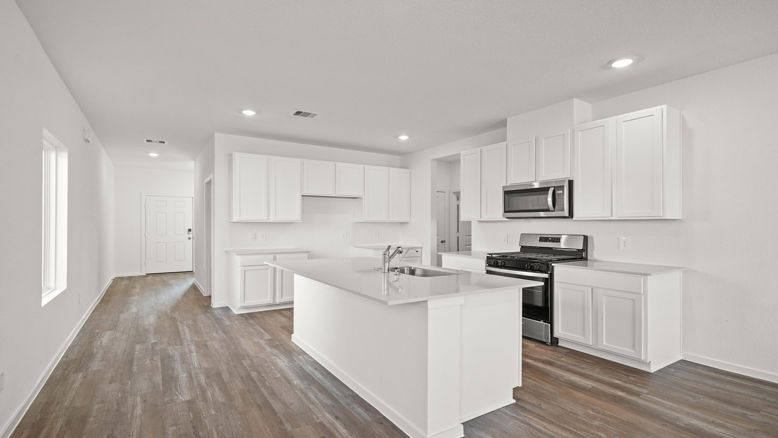 open concept living and dining area with vinyl flooring