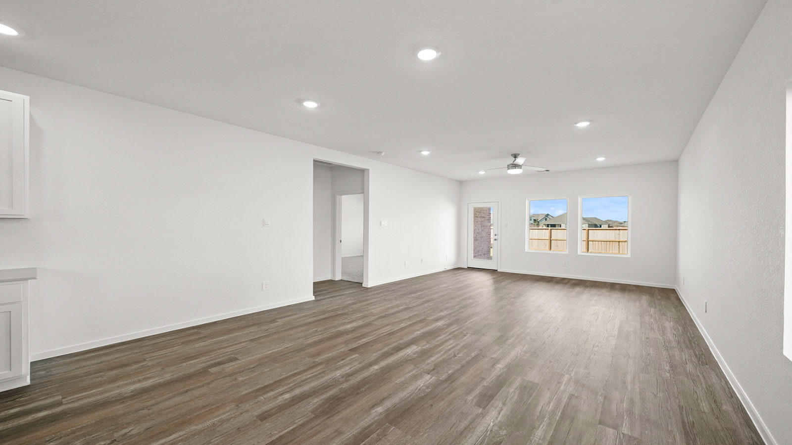 open concept living and dining area with vinyl flooring