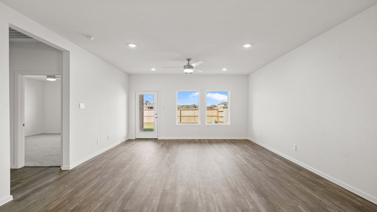 open concept living and dining area with vinyl flooring