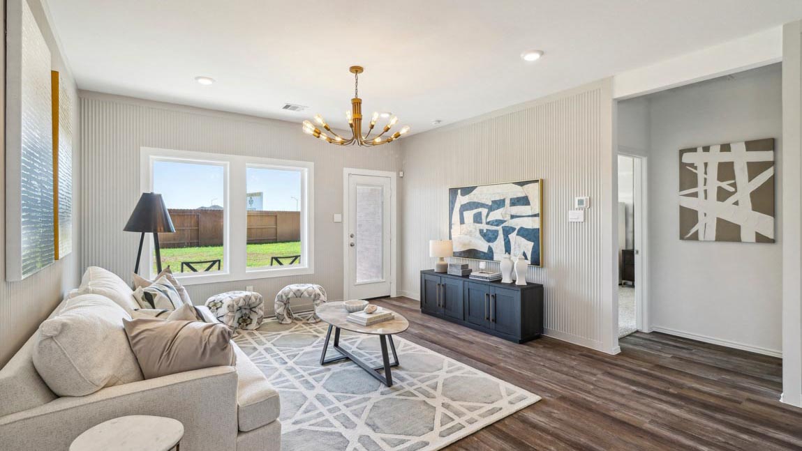 open concept living and dining area with vinyl flooring, quartz countertops, and large windows