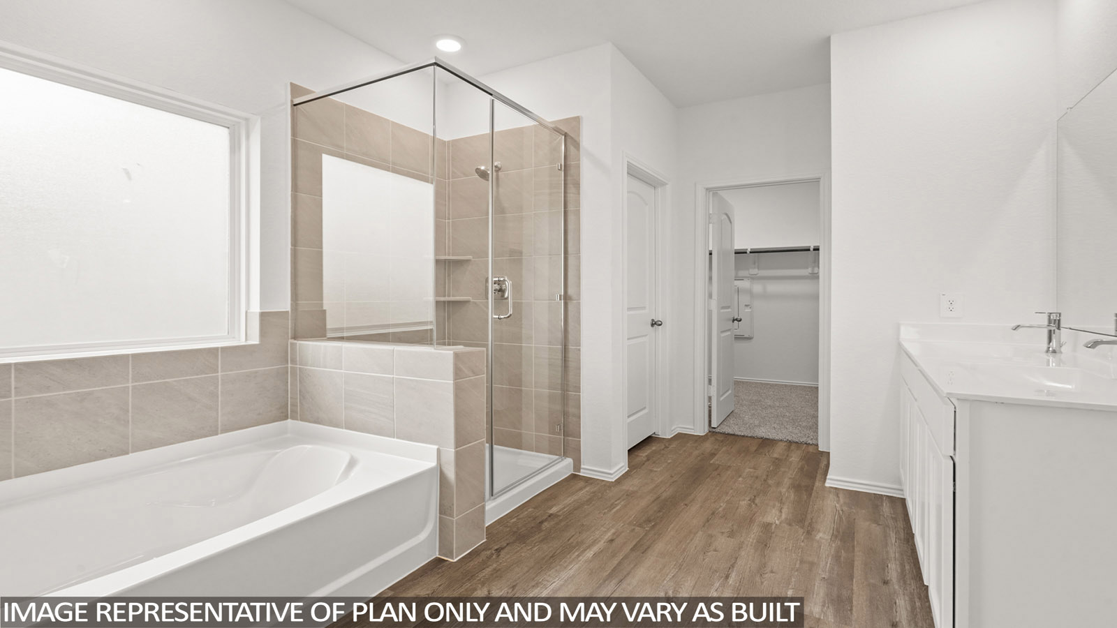 Primary bathroom with dual sinks, shower, tub, white walls, and vinyl wood flooring.
