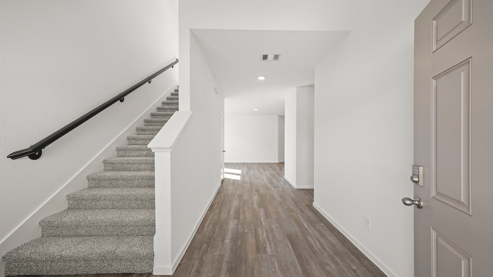 Front Door and stairs access of this new residence bring you home with well-crafted and designed living