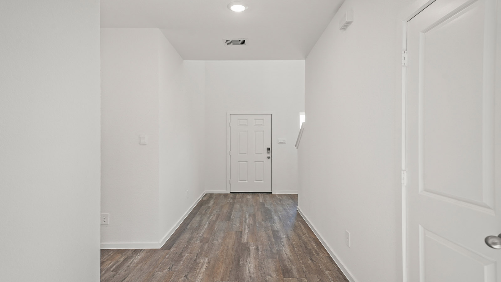 A foyer, entry hall inside front door, next to office, or sitting room adding a welcoming front, direct line of sight to home