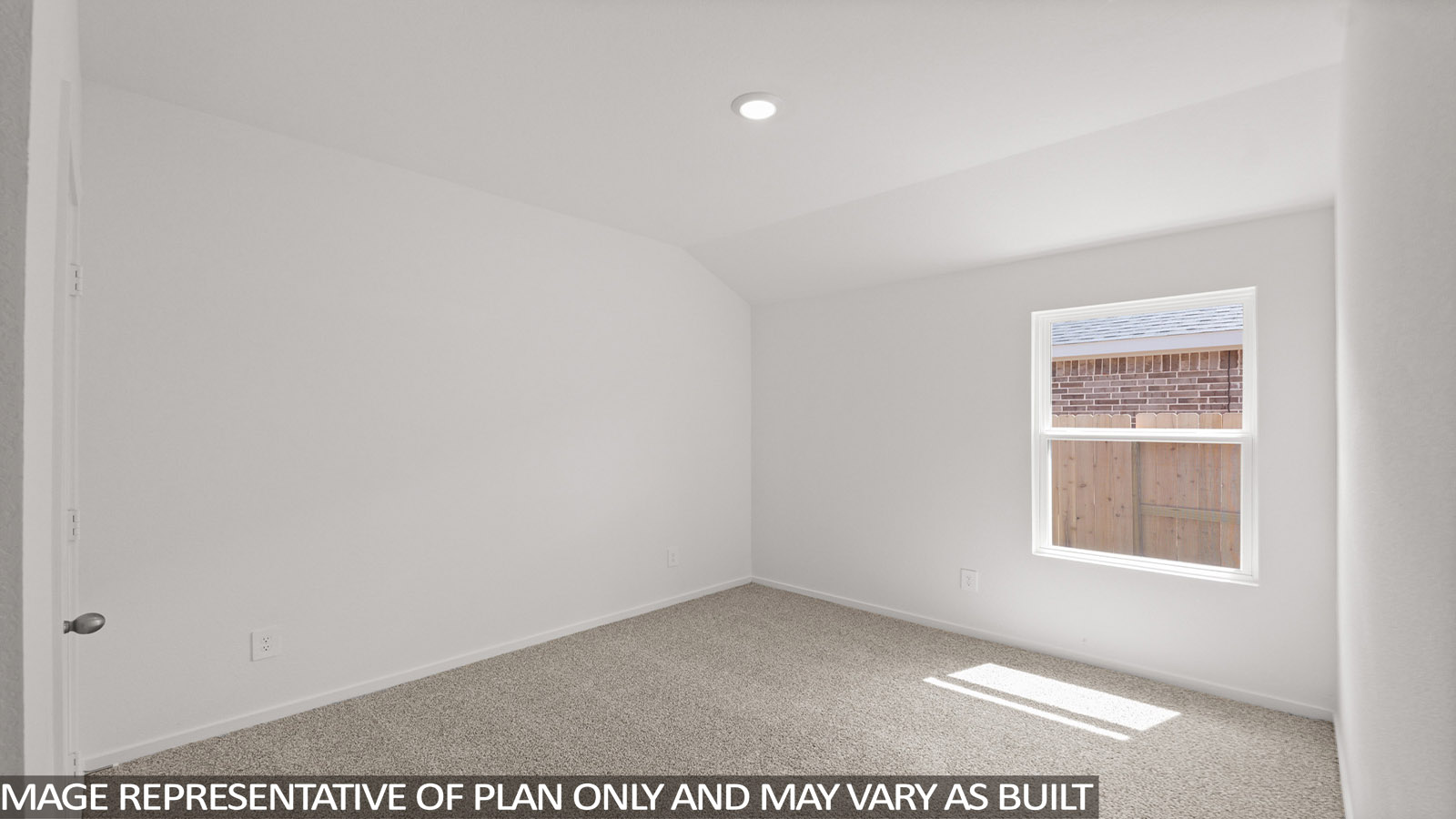 Secondary bedroom with carpet flooring