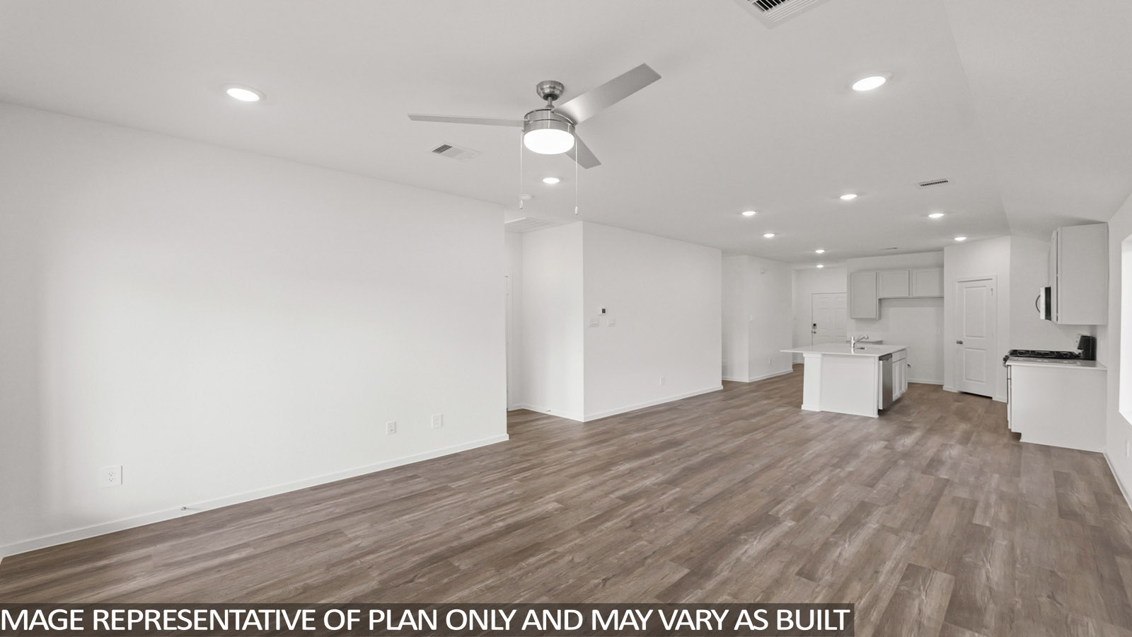 Spacious living area with vinyl flooring