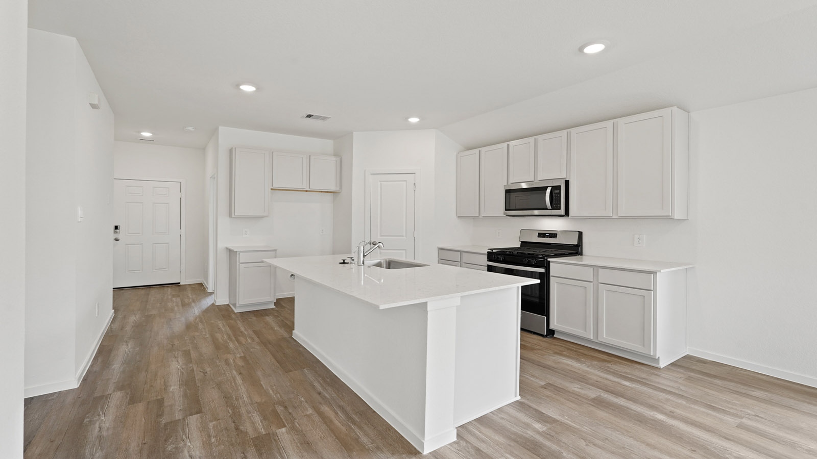 kitchen with quartz xountertops and stainless steeln appiances