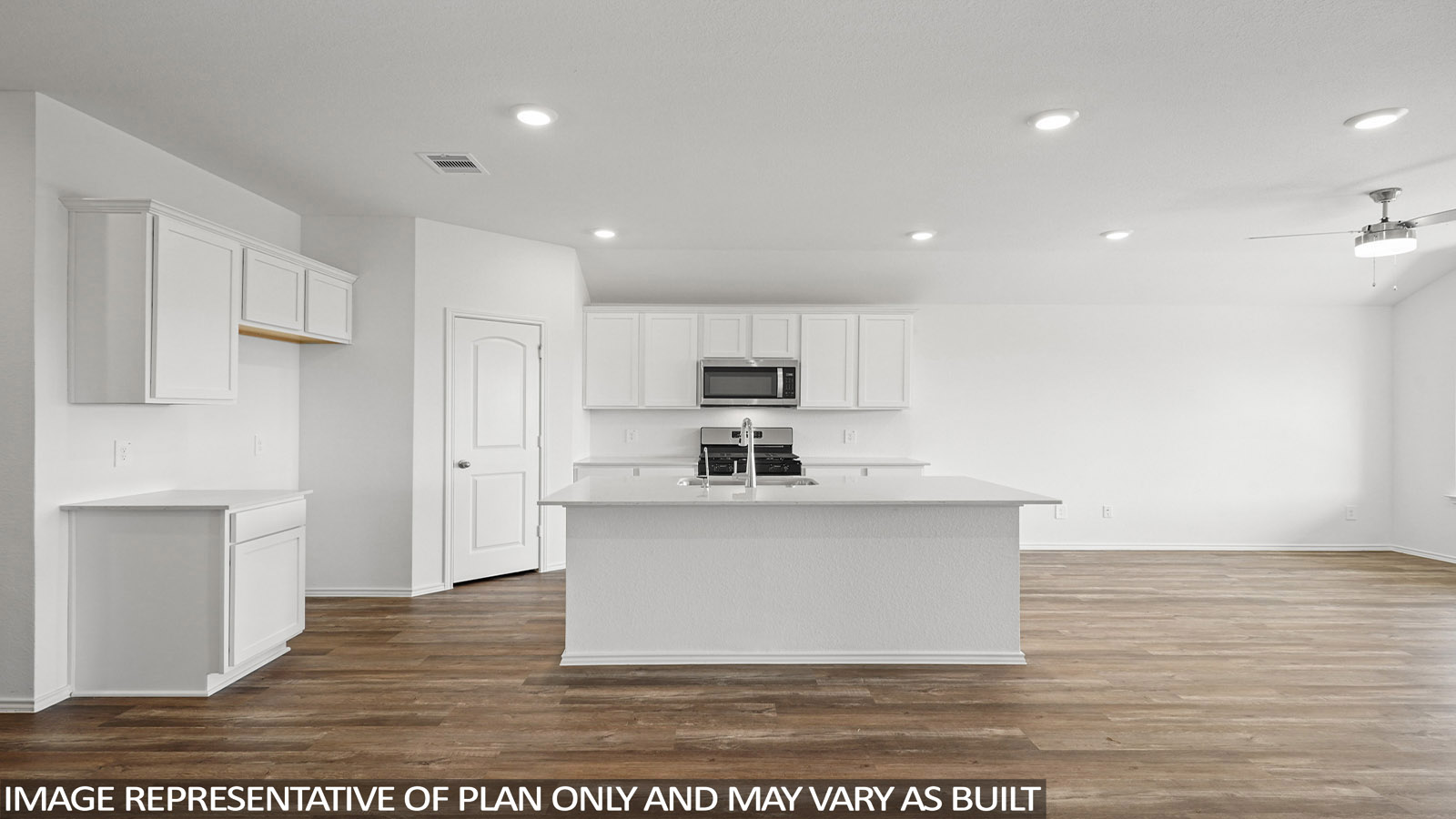 Open kitchen with an island, stainless steel appliances, white cabinets, white walls, and vinyl wood flooring.