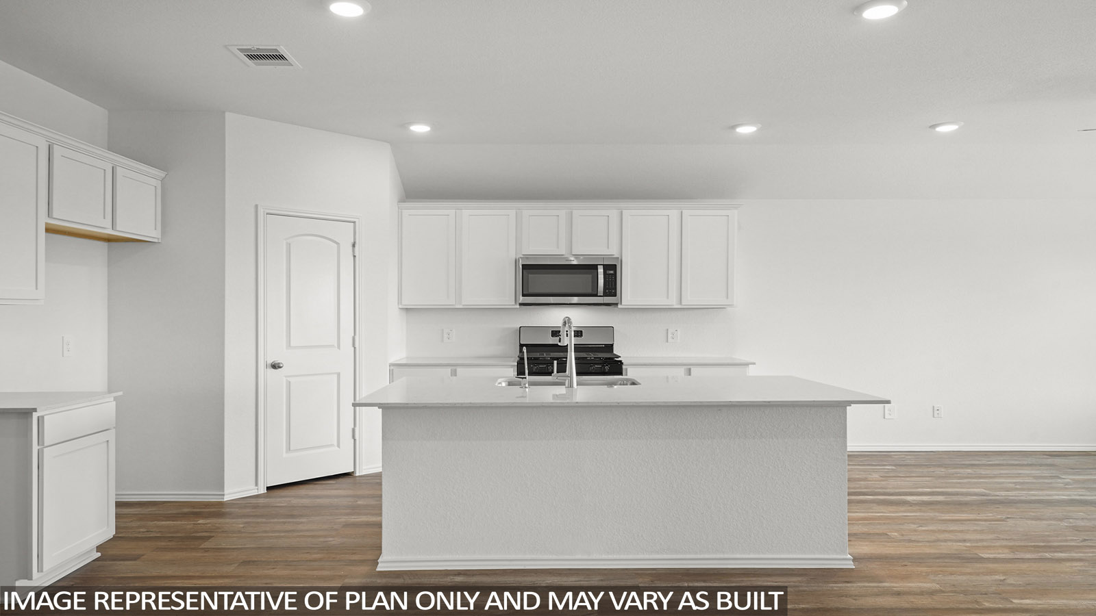 Open kitchen with an island, stainless steel appliances, white cabinets, white walls, and vinyl wood flooring.