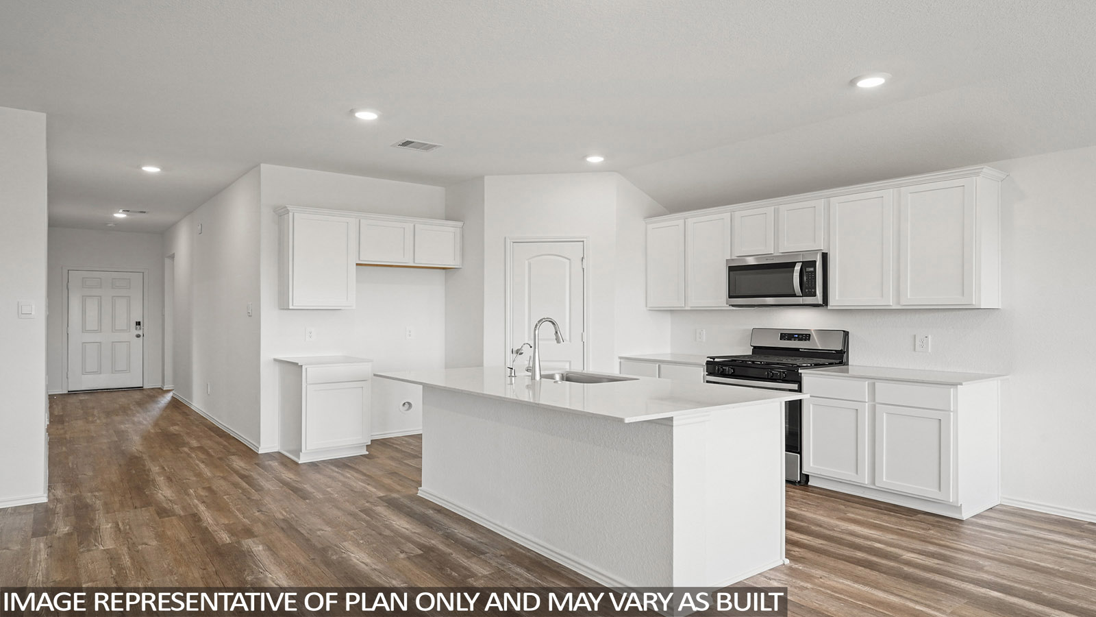 Open kitchen with an island, stainless steel appliances, white cabinets, white walls, and vinyl wood flooring.