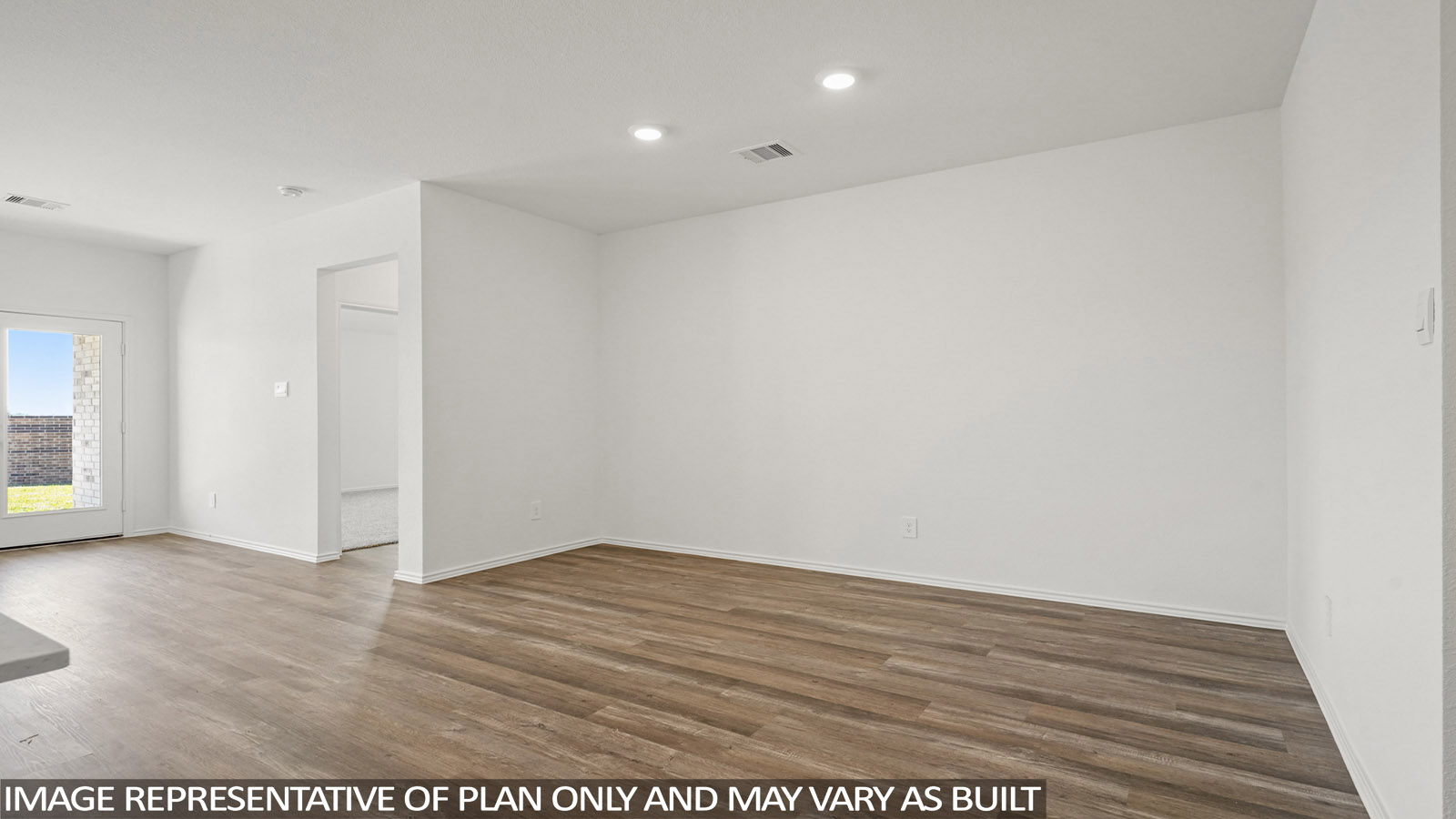Open living room with windows, white walls, and vinyl wood flooring.