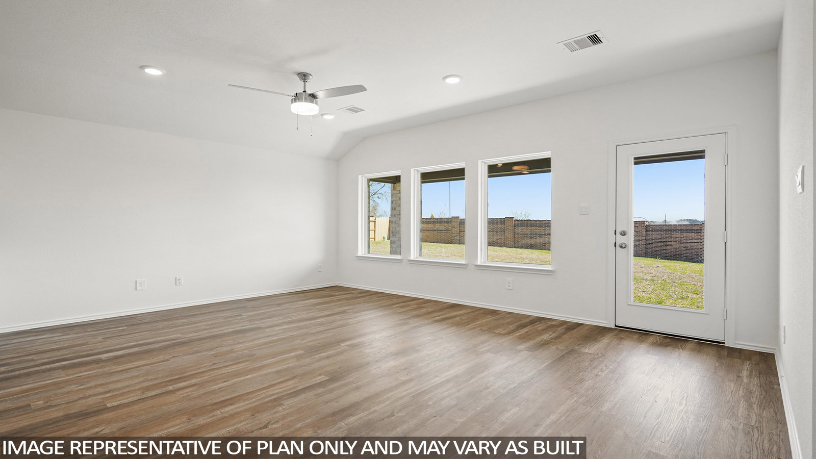 Open living room with windows, white walls, and vinyl wood flooring.