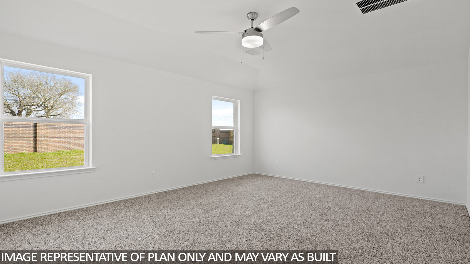 Primary bedroom with windows, white walls, and light carpet.