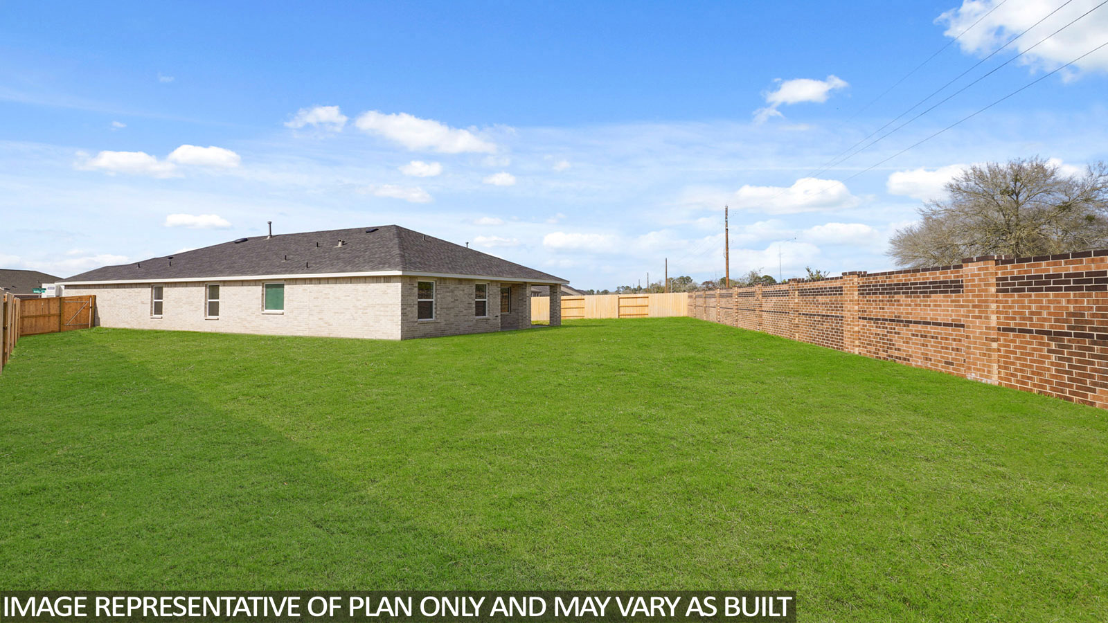 Landscaped backyard with a covered patio.