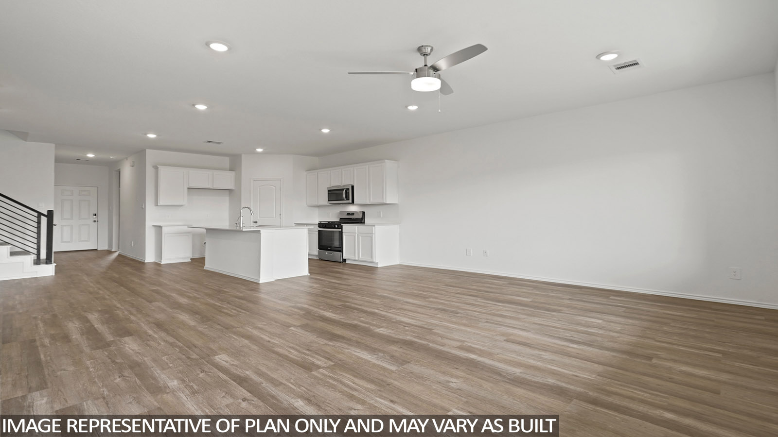Open living room with windows, white walls, and vinyl wood flooring.