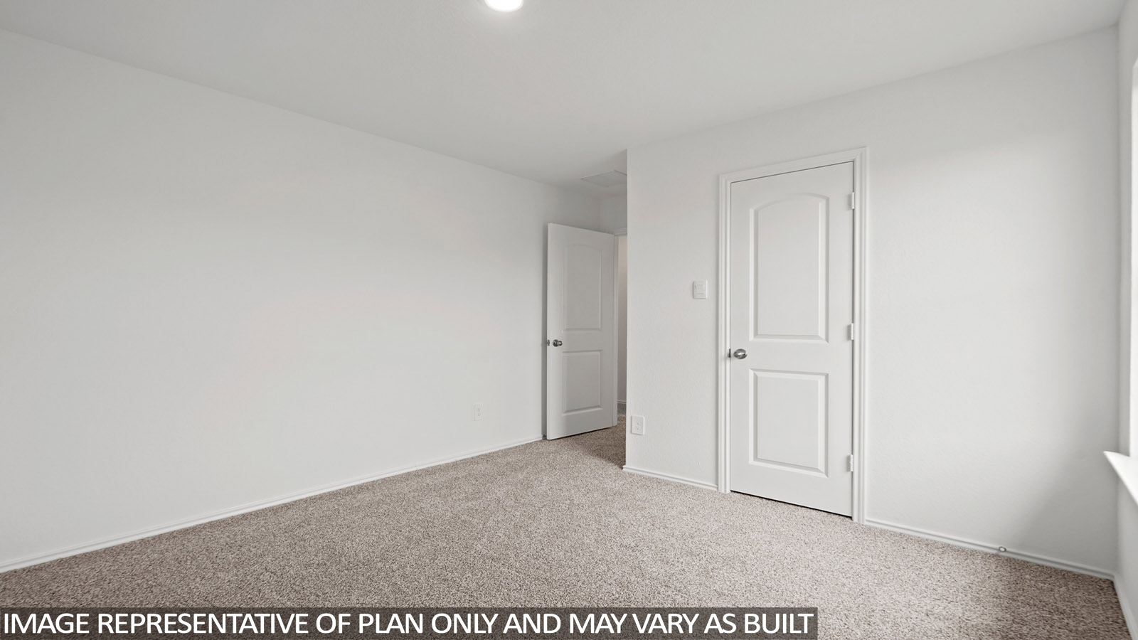 Secondary bedroom with windows, white walls, and light carpet.