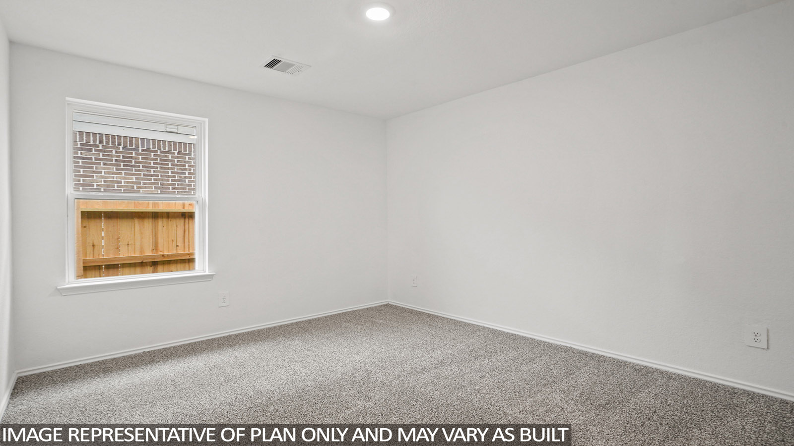 Secondary bedroom with windows, white walls, and light carpet.