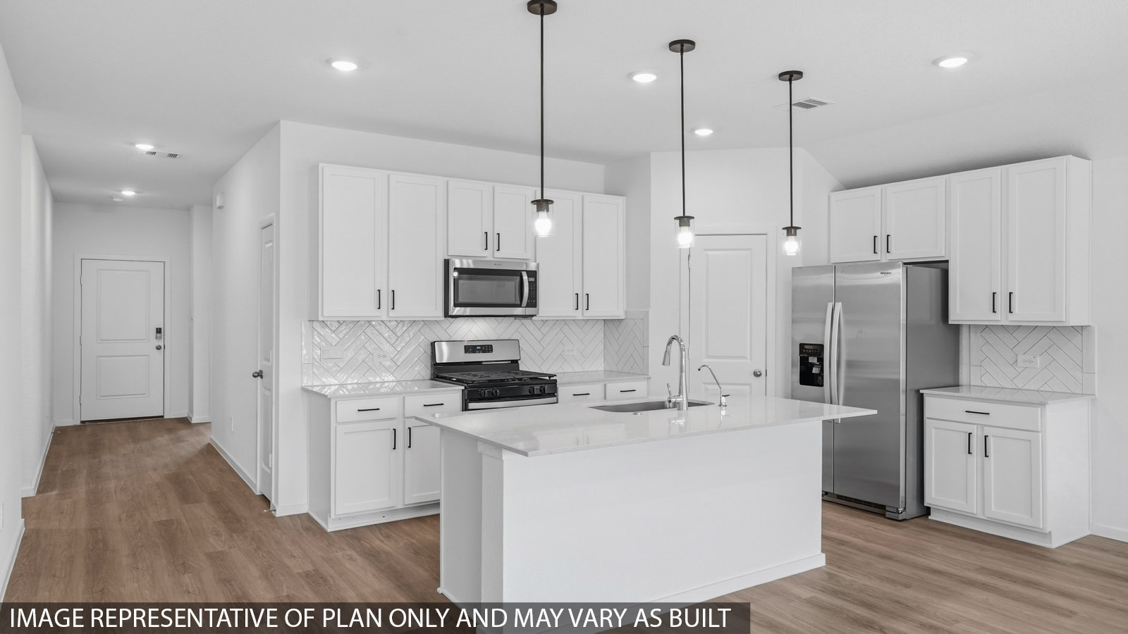 Open kitchen with an island, stainless steel appliances, white cabinets, white walls, and vinyl wood flooring.