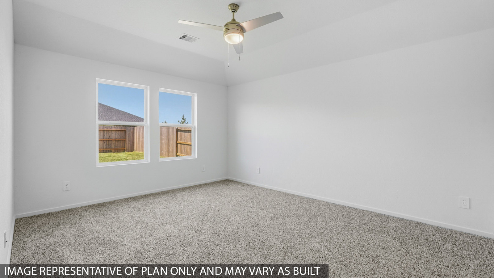 Primary bedroom with white walls, windows, and light carpet.