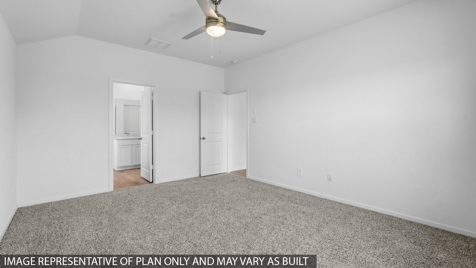 Primary bedroom with white walls, windows, and light carpet.