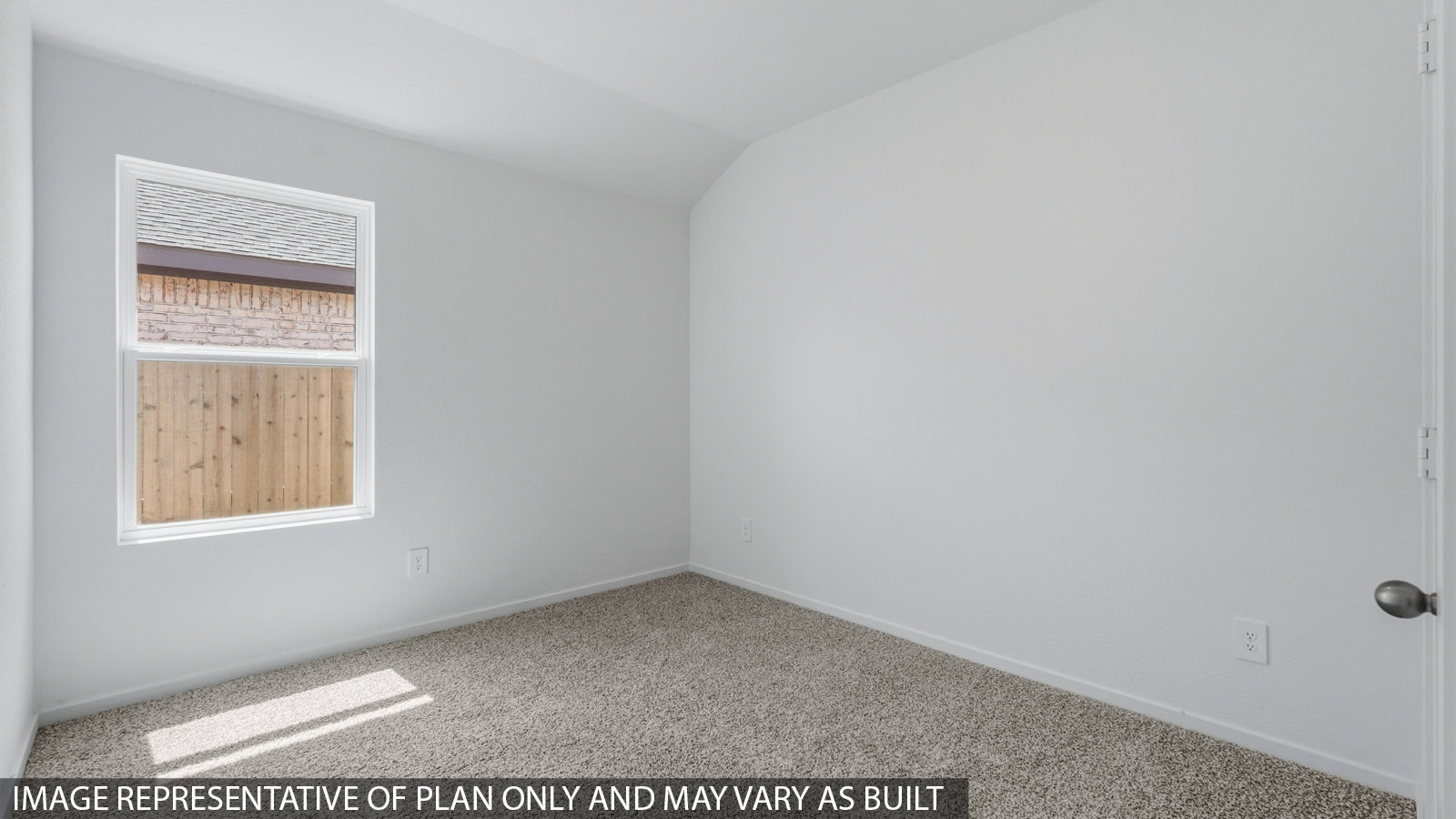 Secondary bedroom with white walls, windows, and light carpet.