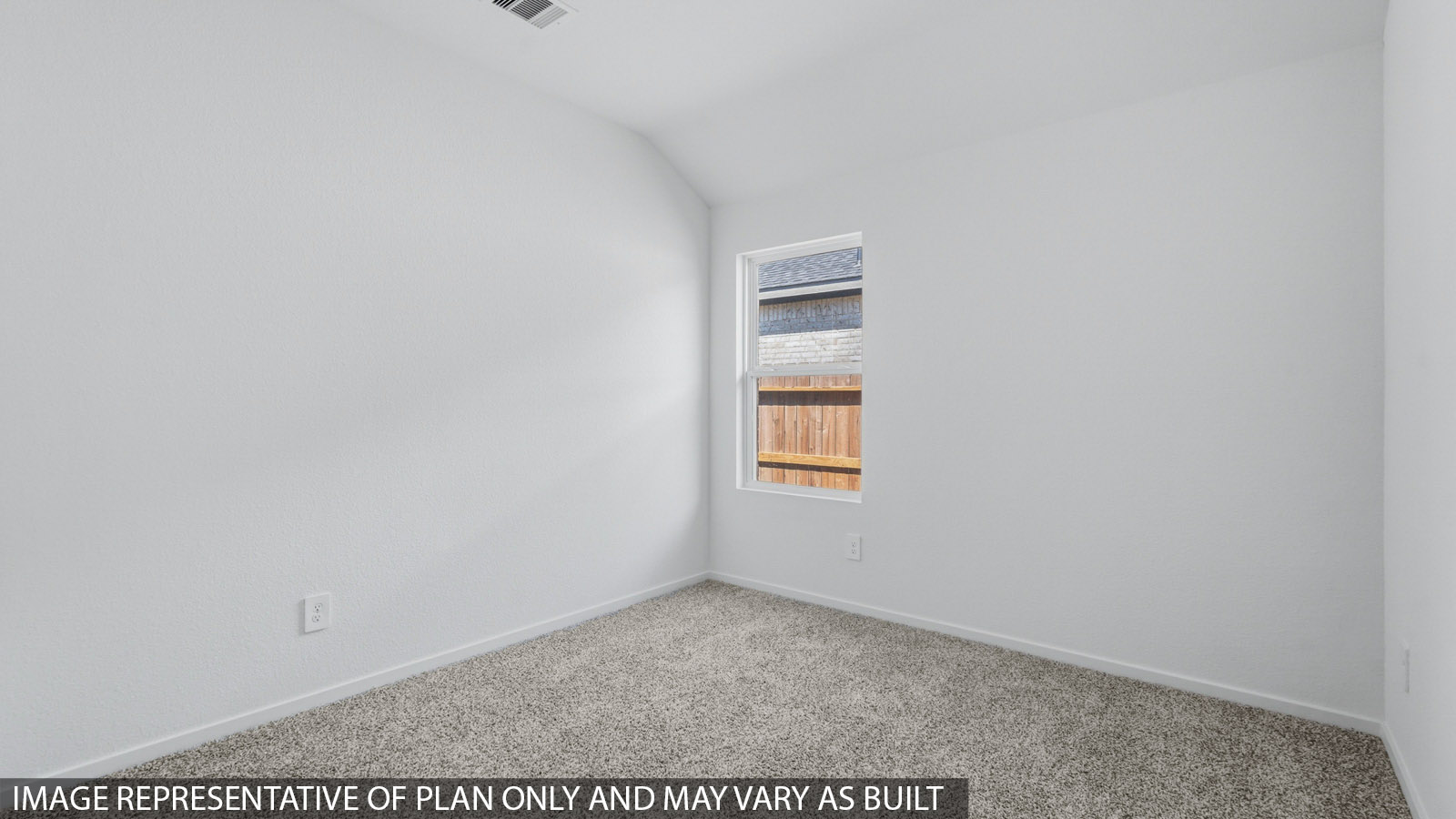 Secondary bedroom with white walls, windows, and light carpet.