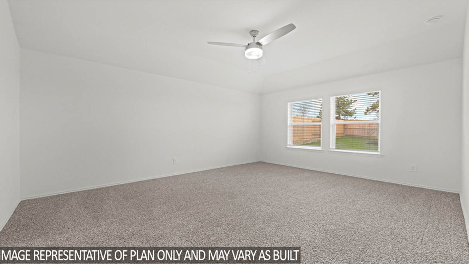 Primary bedroom with white walls, windows, and light carpet.