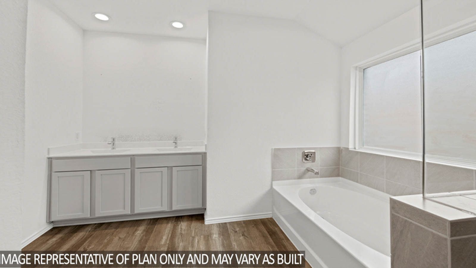 Primary bathroom with a shower, tub, dual sinks, white cabinets, white walls, and vinyl wood flooring.