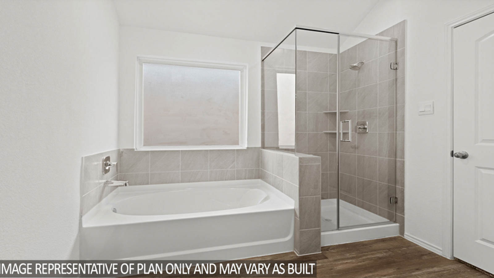 Primary bathroom with a shower, tub, dual sinks, white cabinets, white walls, and vinyl wood flooring.