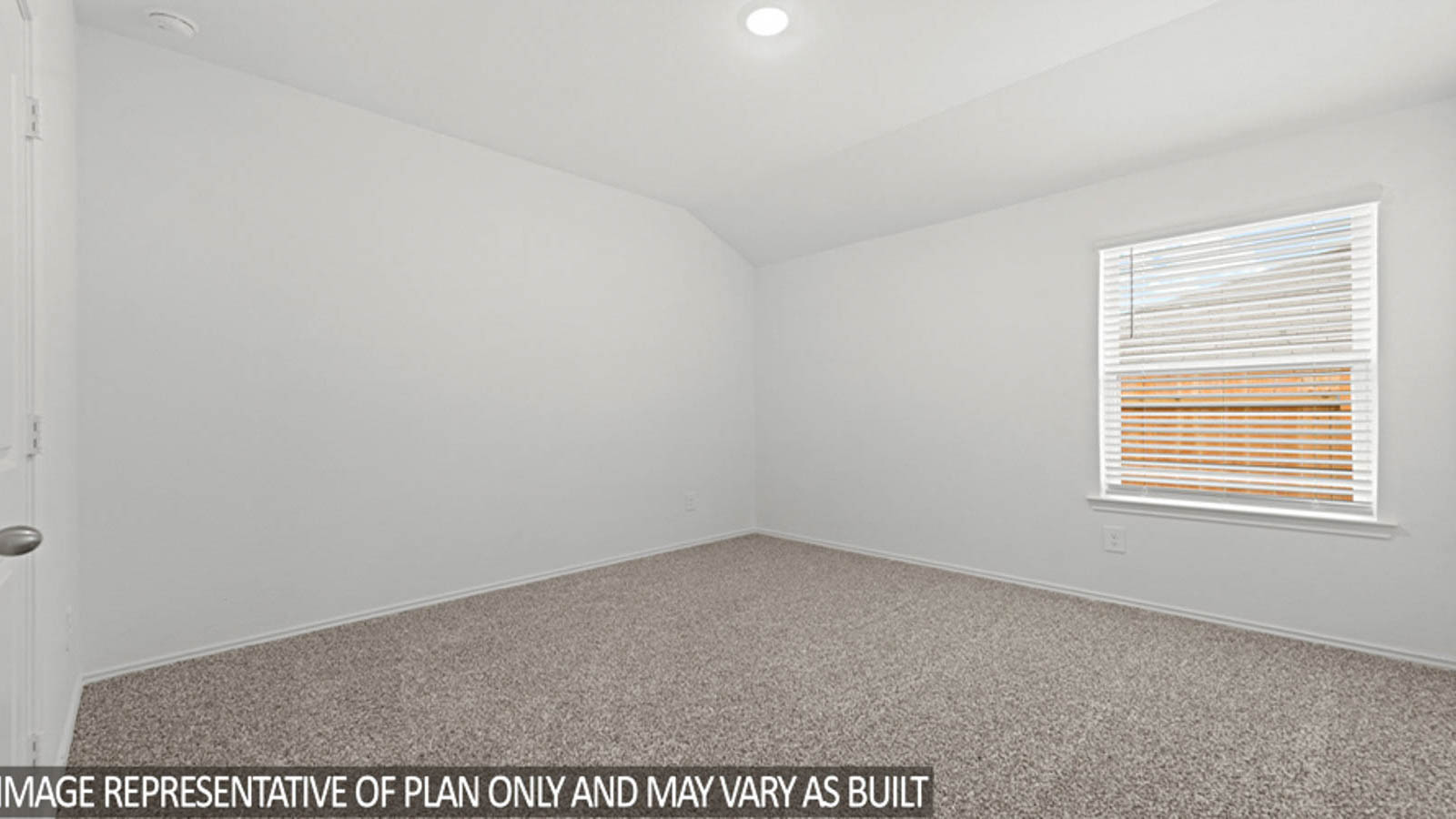 Secondary bedroom with white walls, windows, and light carpet.