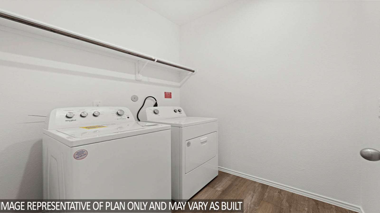 Laundry room with white walls and vinyl wood flooring.