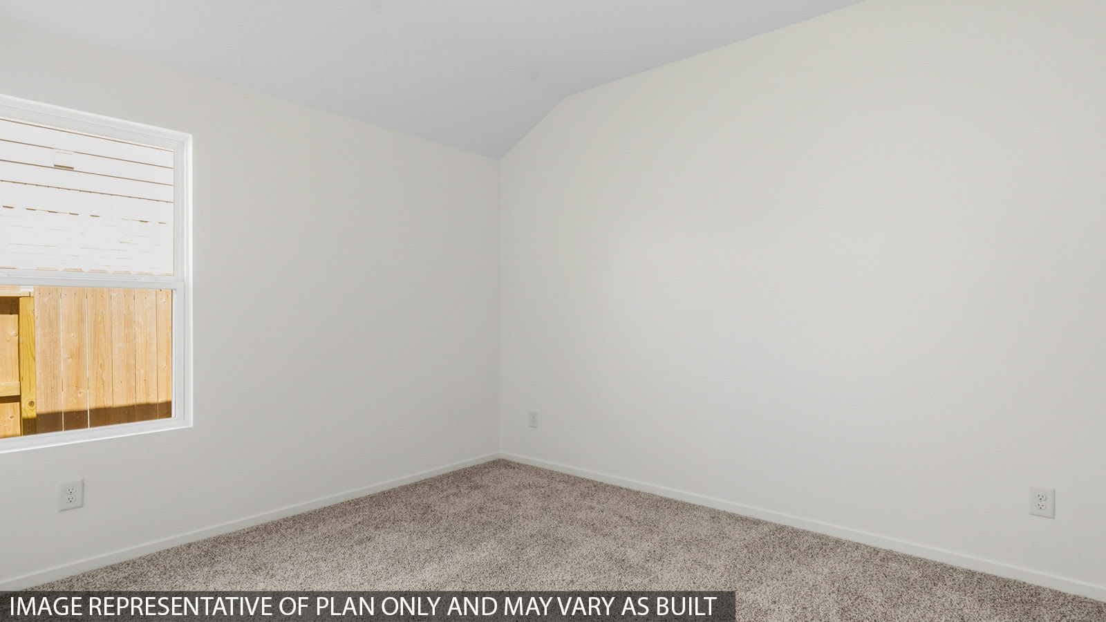 Secondary bedroom with white walls, windows, and light carpet.