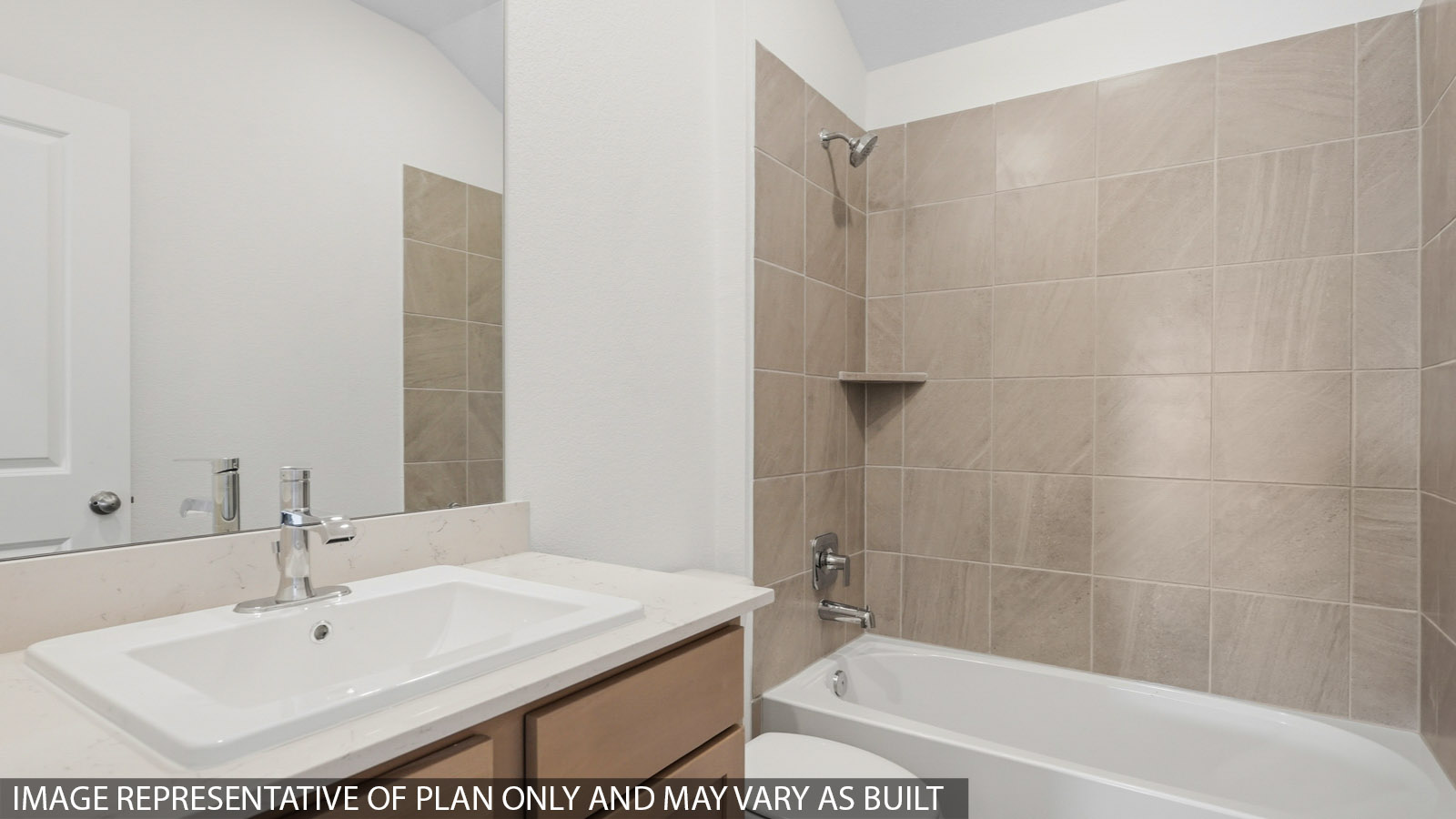 Secondary bathroom with a shower and tub combo, toilet, sink, white walls, and vinyl wood flooring.