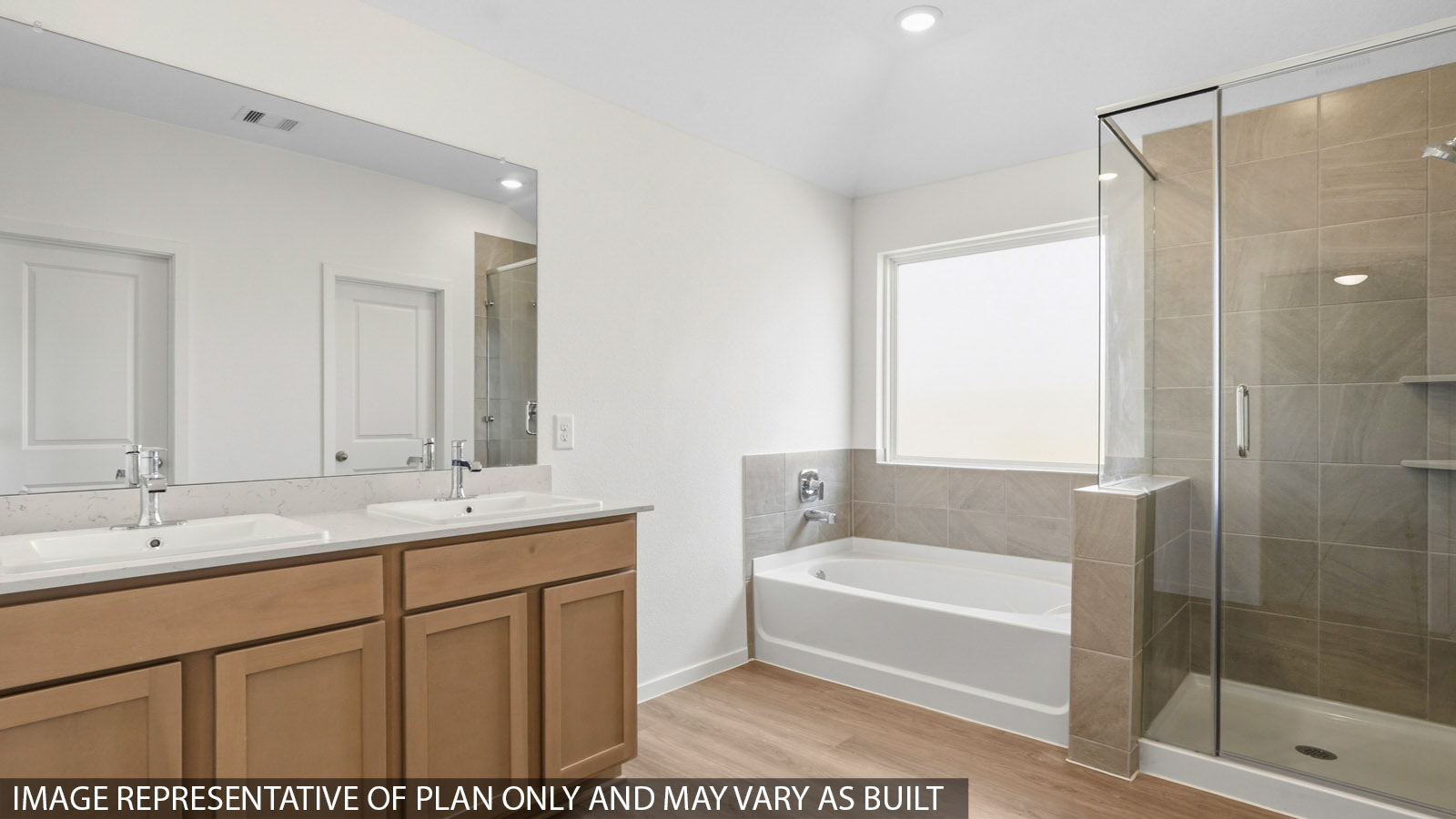 Primary bathroom with a shower, tub, dual sinks, white cabinets, white walls, and vinyl wood flooring.