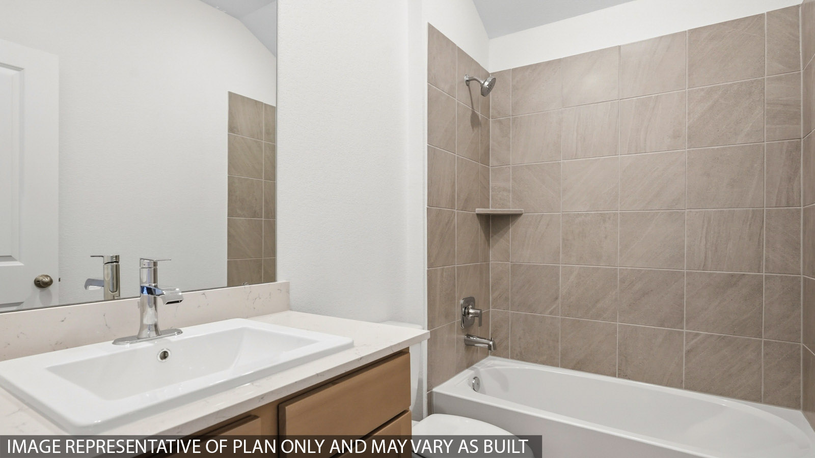 Secondary bathroom with a shower and tub combo, toilet, sink, white walls, and vinyl wood flooring.
