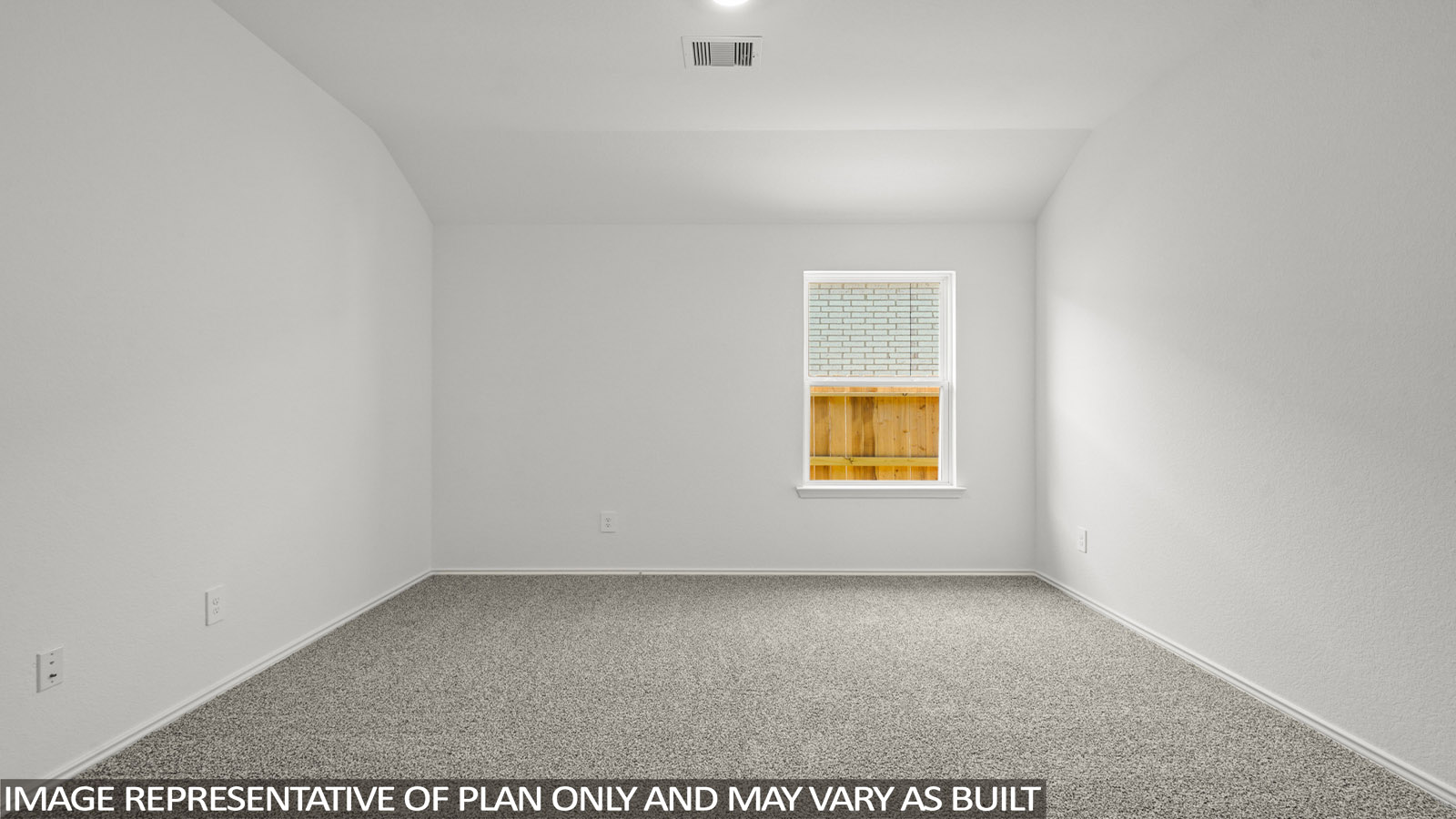 Secondary bedroom with windows, white walls, and light carpet.